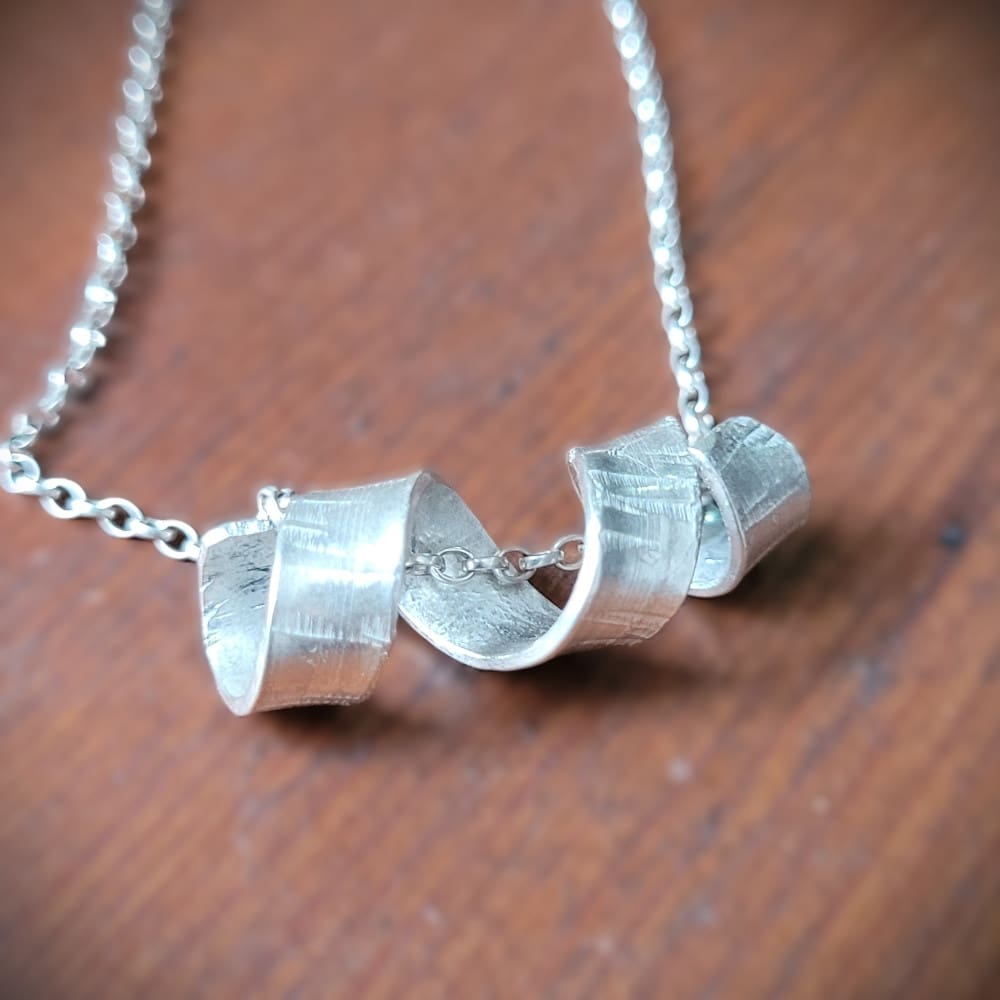 Sterling silver necklace with twisted spiral centrepiece reminiscent of silver birch tree bark.