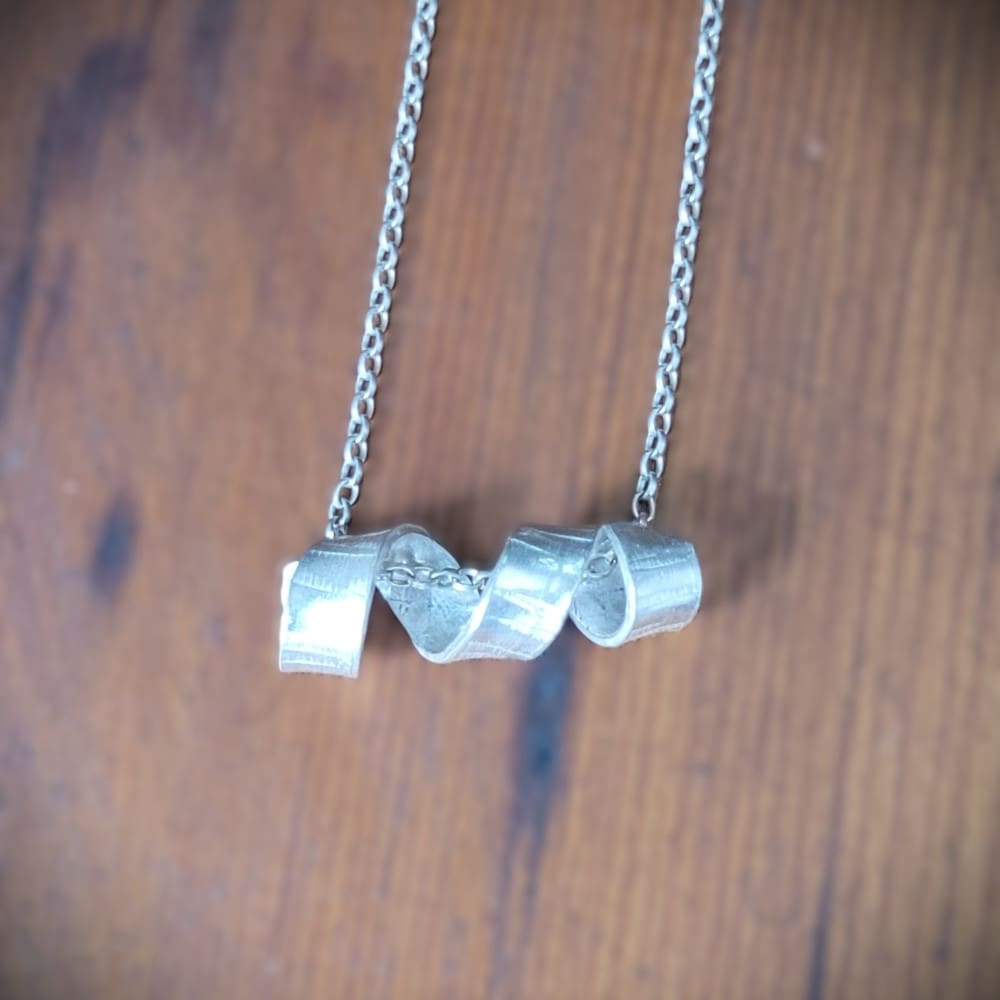 Sterling silver necklace with twisted spiral centrepiece reminiscent of silver birch tree bark.