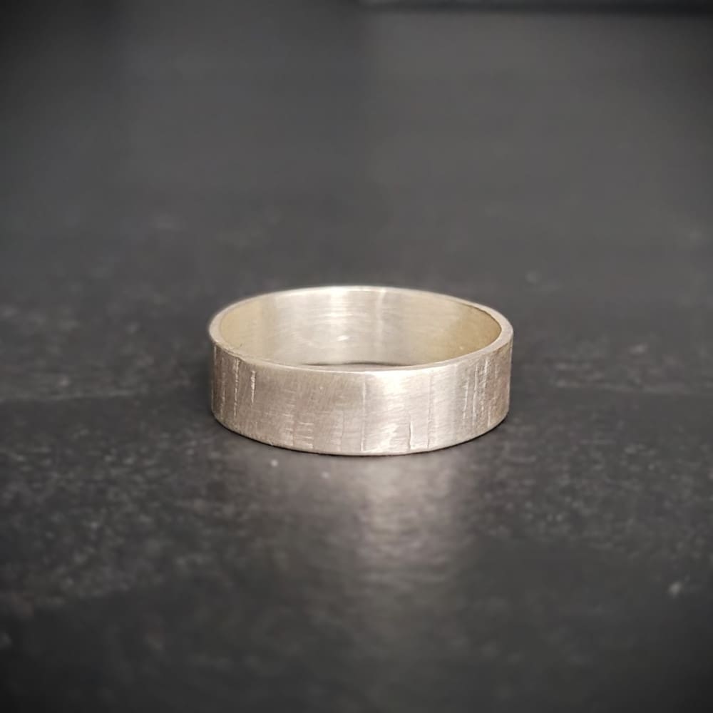 Simple sterling silver ring band with texture inspired by silver birch tree bark.