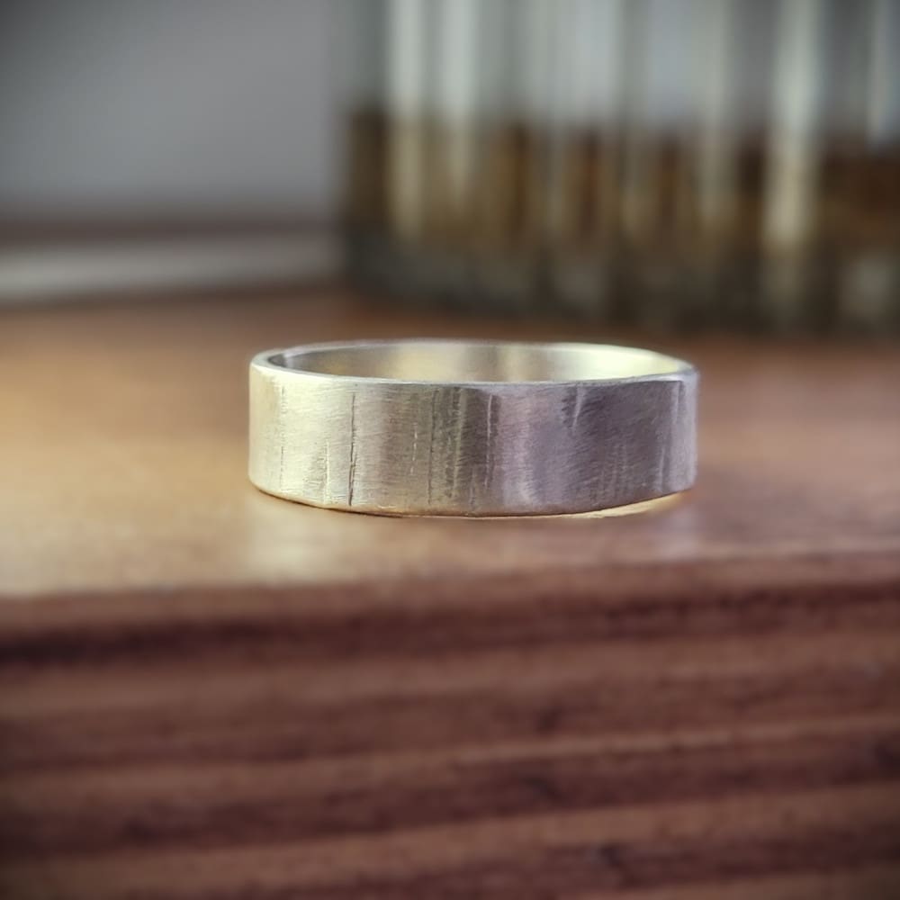 Simple sterling silver ring band with texture inspired by silver birch tree bark.