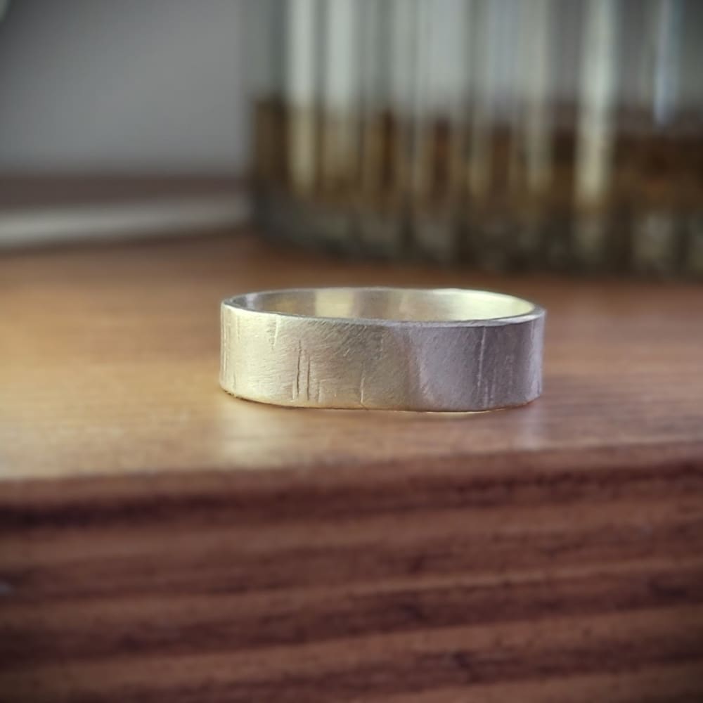 Simple sterling silver ring band with texture inspired by silver birch tree bark.