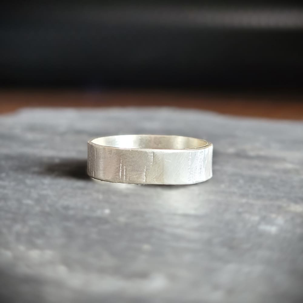 Simple sterling silver ring band with texture inspired by silver birch tree bark.