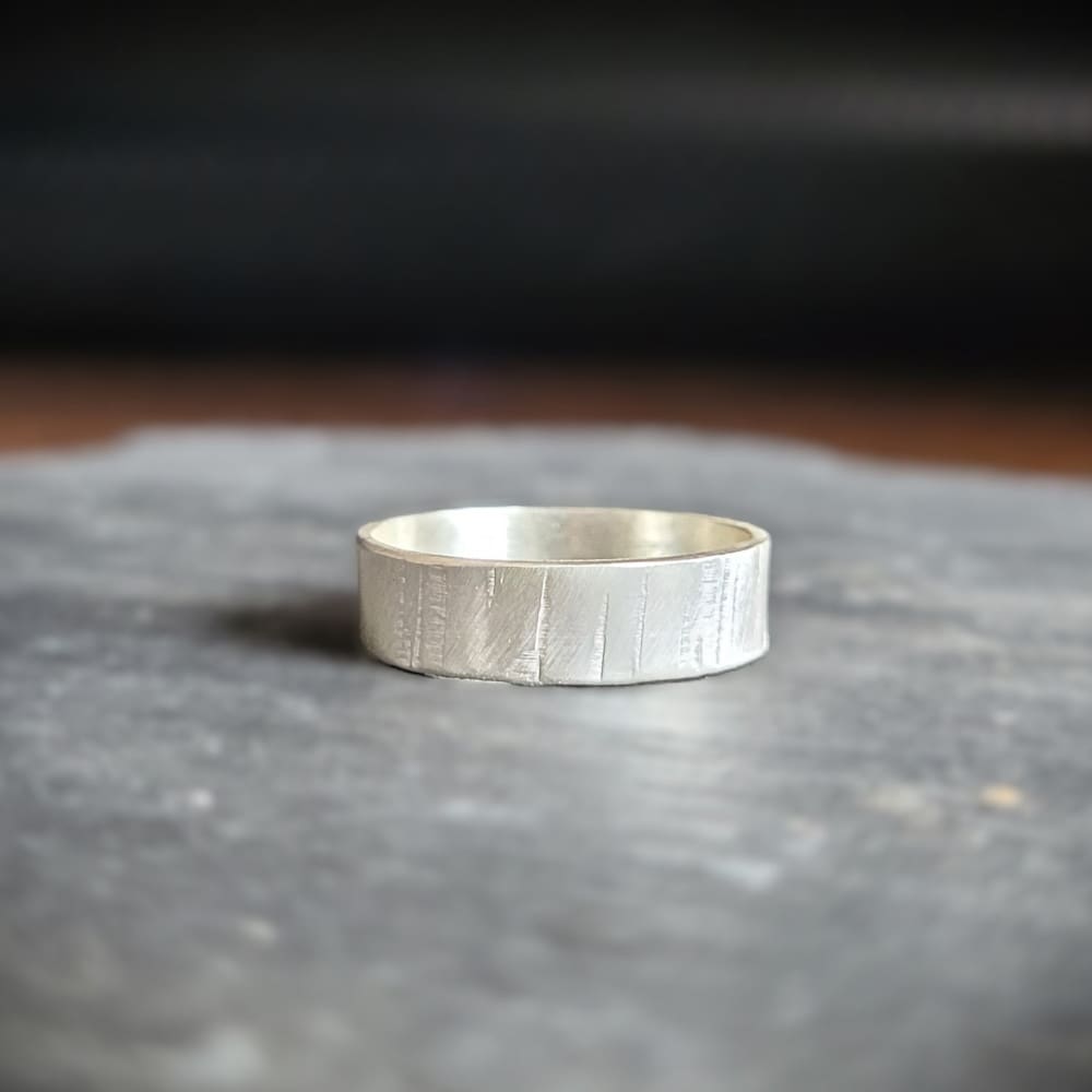 Simple sterling silver ring band with texture inspired by silver birch tree bark.