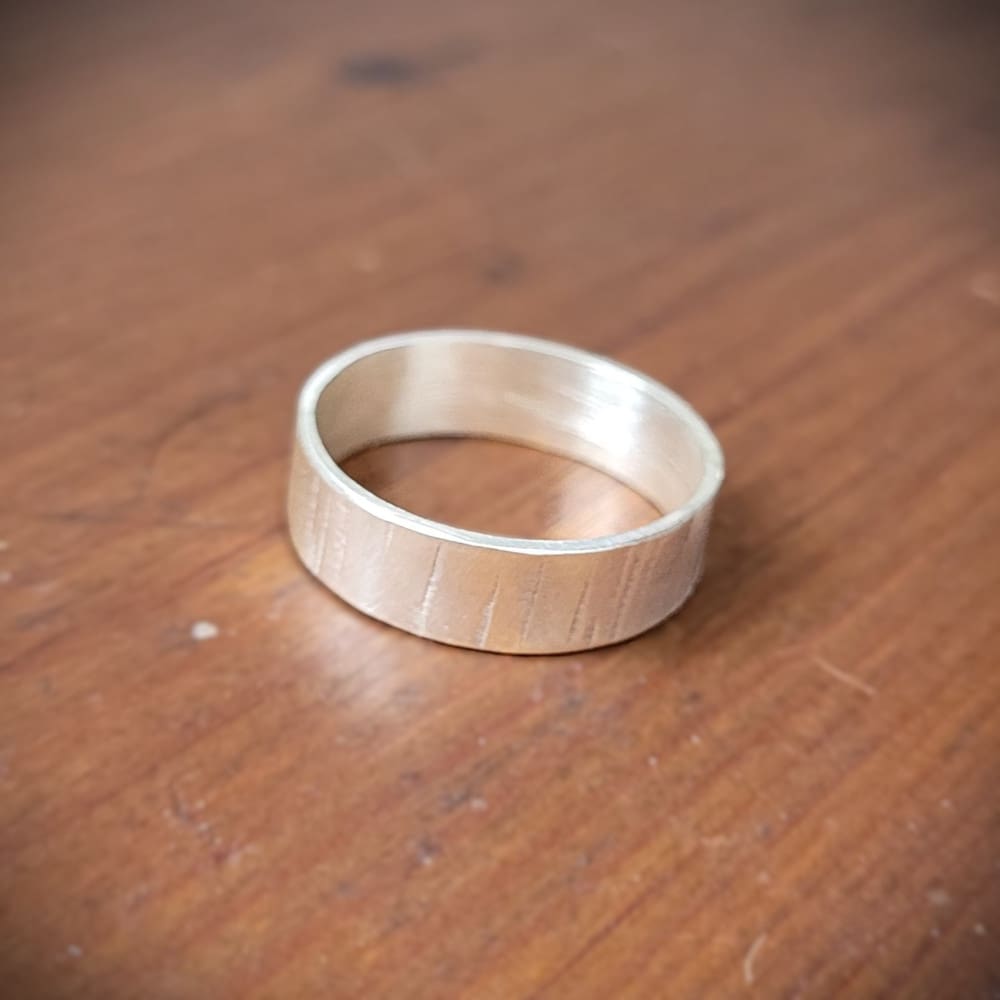 Simple sterling silver ring band with texture inspired by silver birch tree bark.