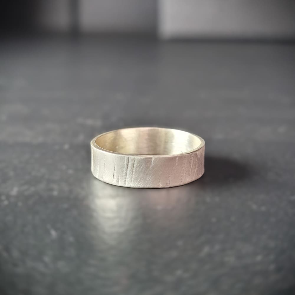 Simple sterling silver ring band with texture inspired by silver birch tree bark.