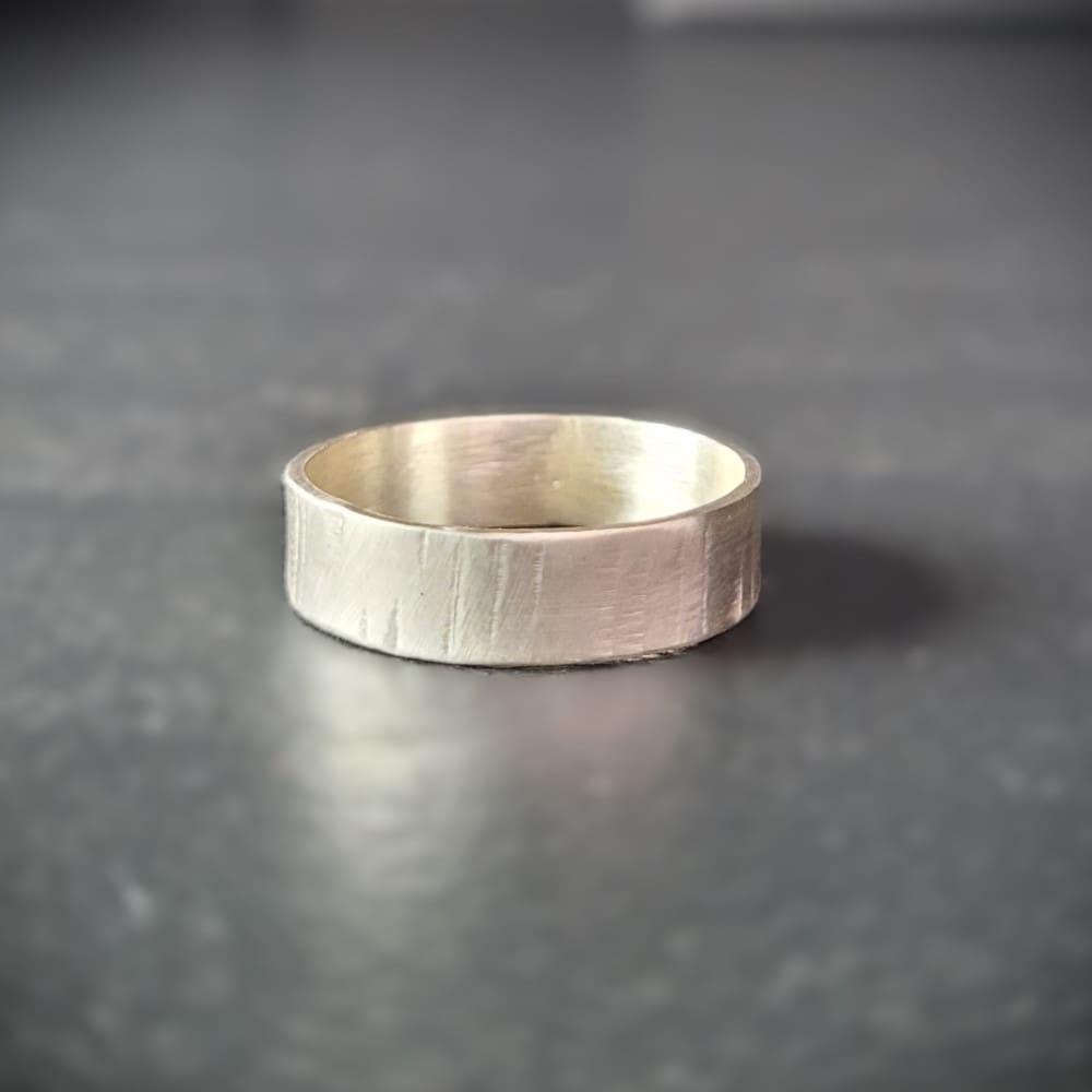 Simple sterling silver ring band with texture inspired by silver birch tree bark.