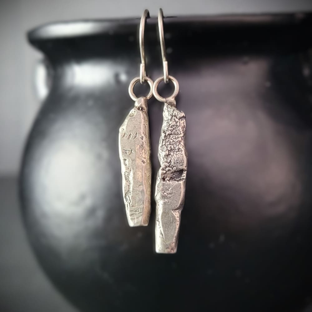 Sterling silver earrings in the shape of miniature standing stones.