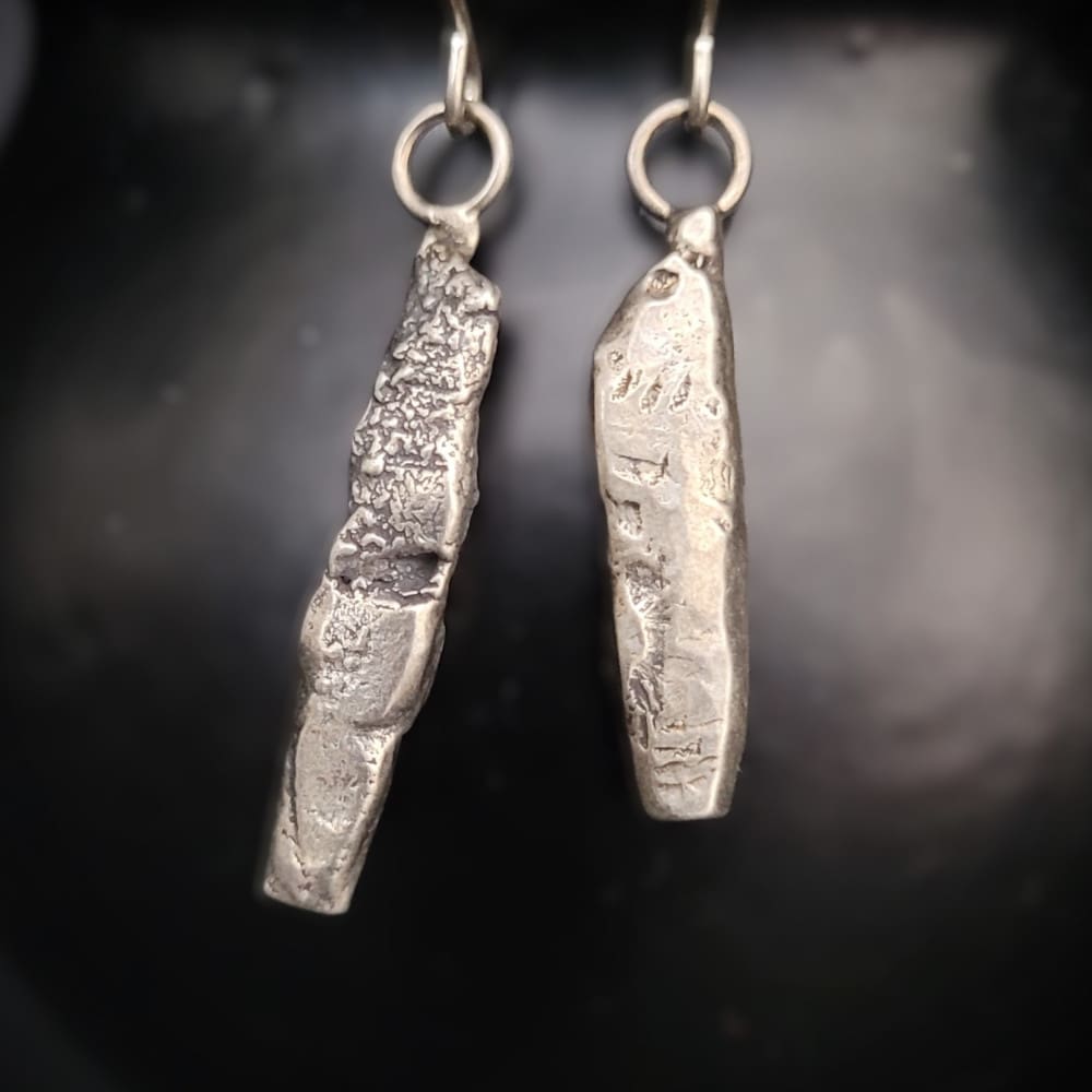 Sterling silver earrings in the shape of miniature standing stones.