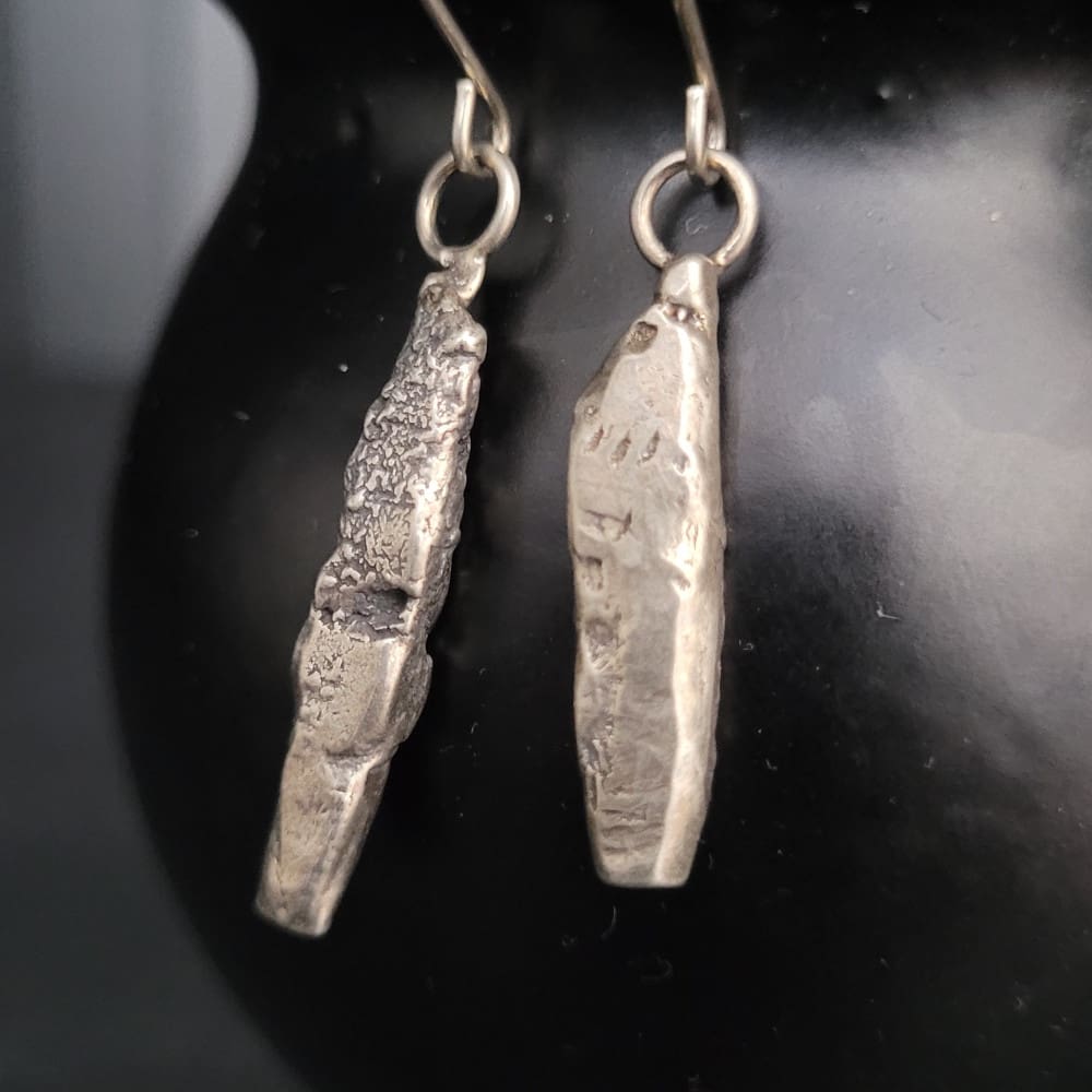 Sterling silver earrings in the shape of miniature standing stones.