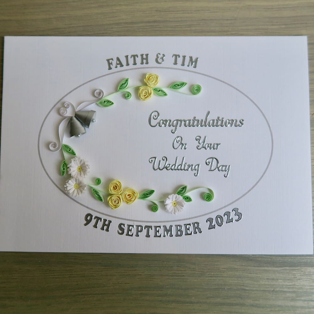 Handmade wedding card with quilled bells and roses