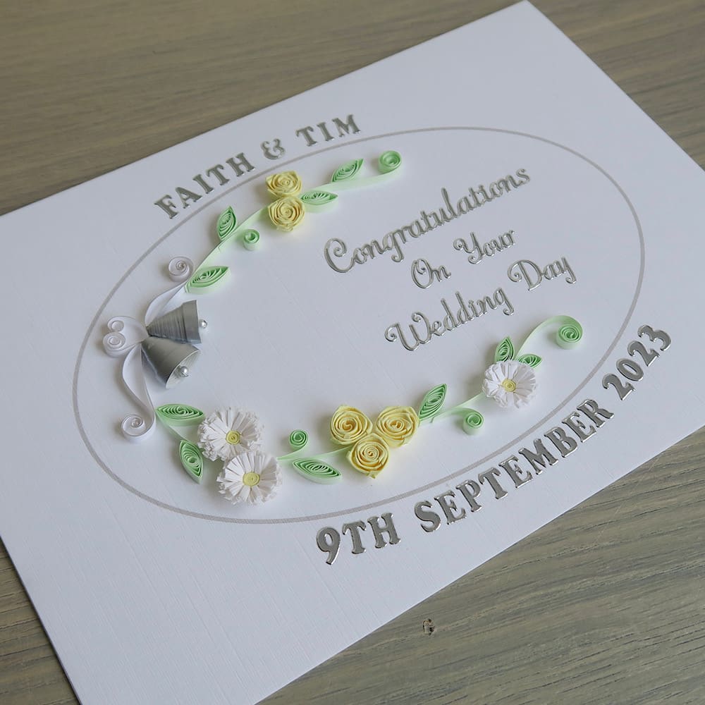 Handmade wedding card with quilled bells and roses