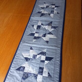 Winter Christmas stars grey and blue patchwork table runner