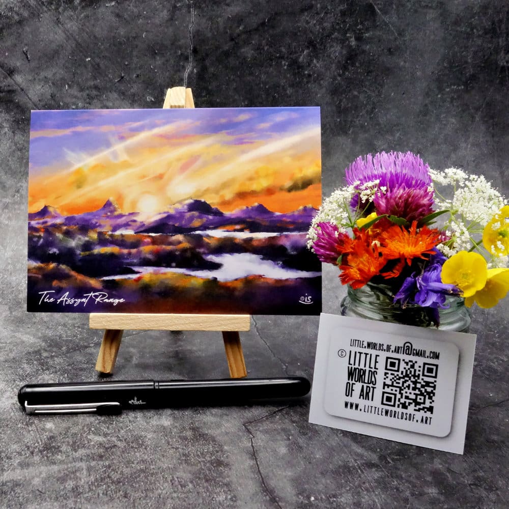 Image titled The Assynt Range showing an A6 size greetings card, blank inside, on a small easel depicting a view of the Assynt mountain range. From Left, Canisp, Suilven, Cul Mhor, Cul Beg and Stac Pollaidh - viewed from the North.