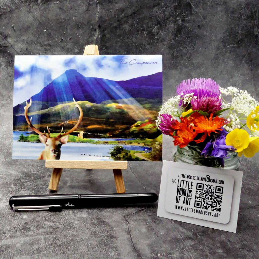 Image titled The Campervan showing an A6 size greetings card, blank inside, on a small easel depicting a view across loch Assynt to Ardvreck Castle and Quinag from a viewpoint on the A837.