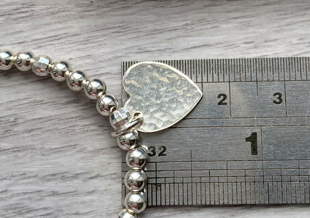 recycled sterling silver stretch bracelet with hammered texture heart charm