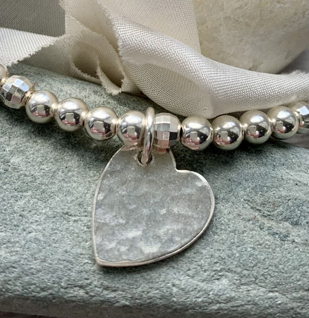 recycled sterling silver stretch bracelet with hammered texture heart charm