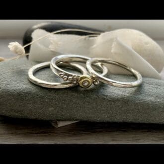 recycled silver and gold set of three stacking rings hammered texture pebble details