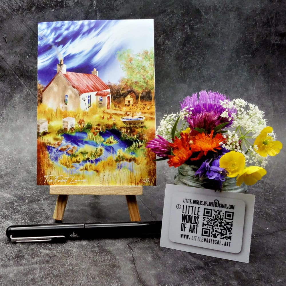 Image titled The Front Lawn an A6 size greetings card, blank inside, on a small easel depicting a view of an overgrown front lawn with hens and bees on an old highland croft.