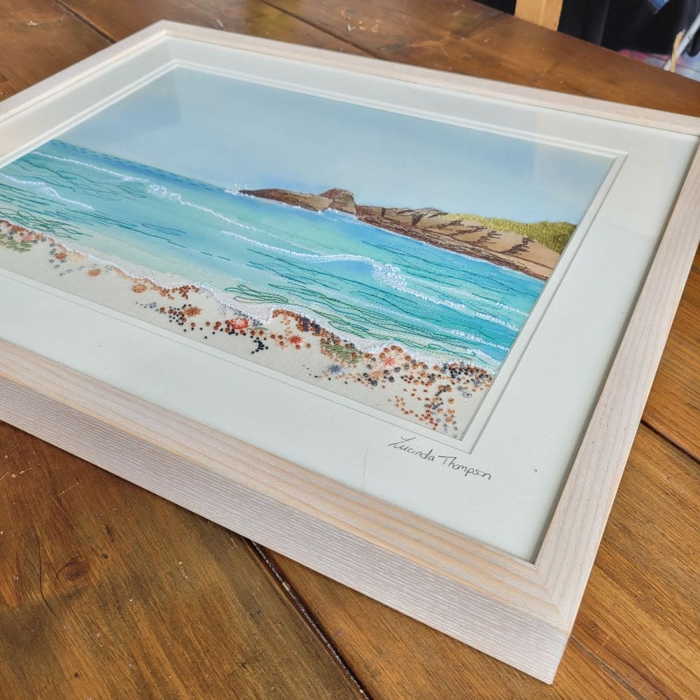 Hand and machine embroidered view of broad haven beach in Pembrokeshire. Large frame measuring 54 x 44cm.