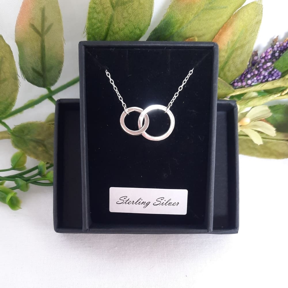 Silver connecting circles necklace.