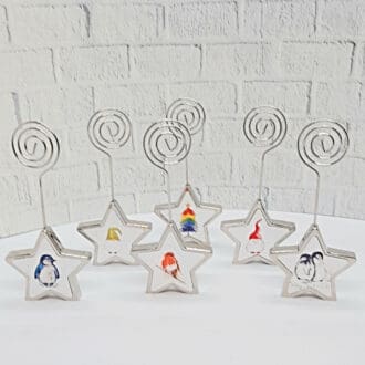 Chrome Christmas Star place card holders with miniature Christmas art