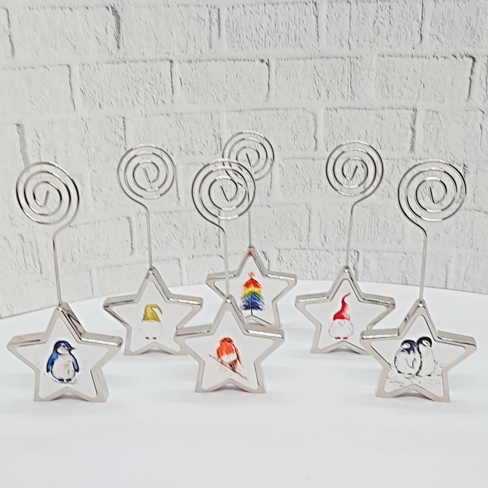 Chrome Christmas Star place card holders with miniature Christmas art