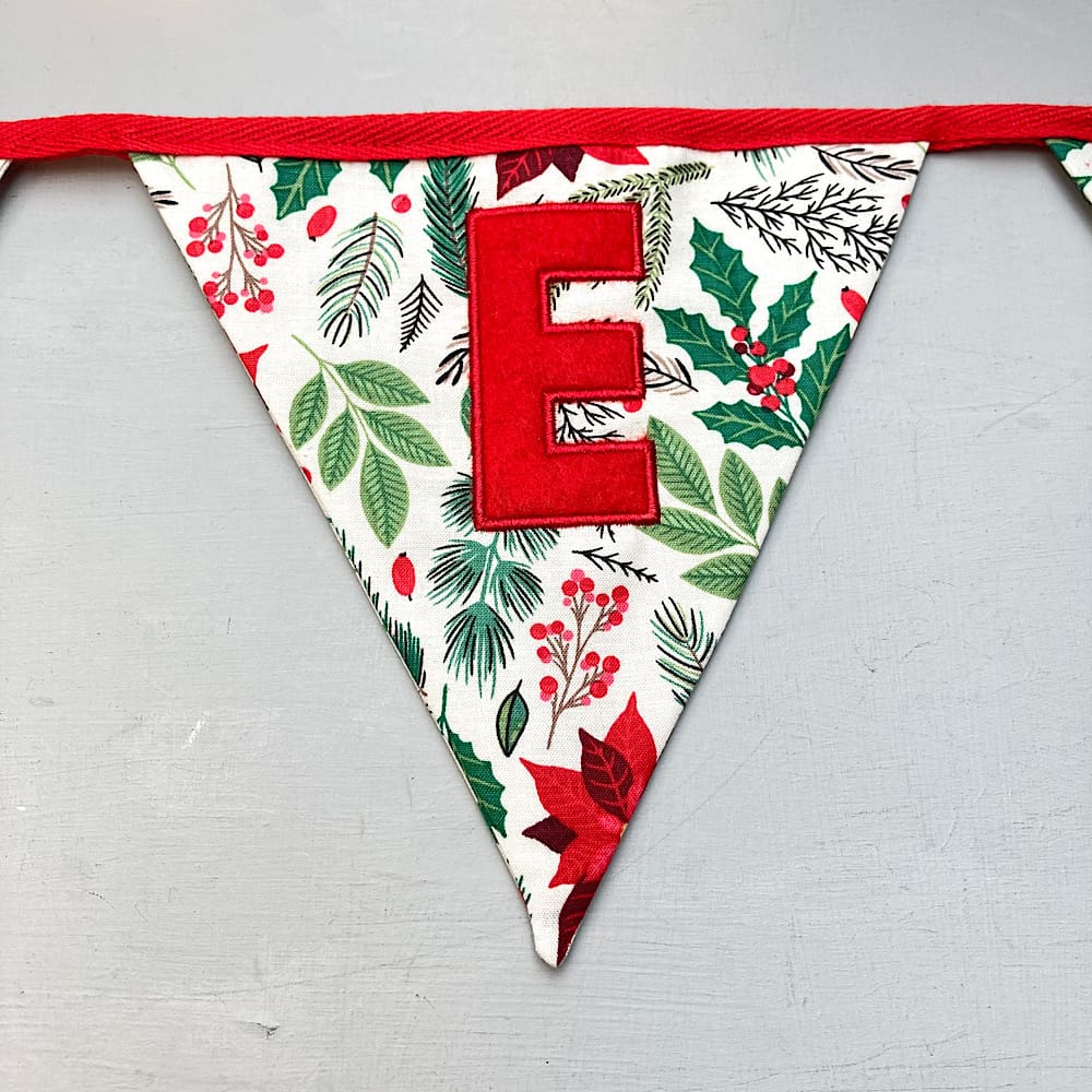 Embroidered letter on Christmas Bunting