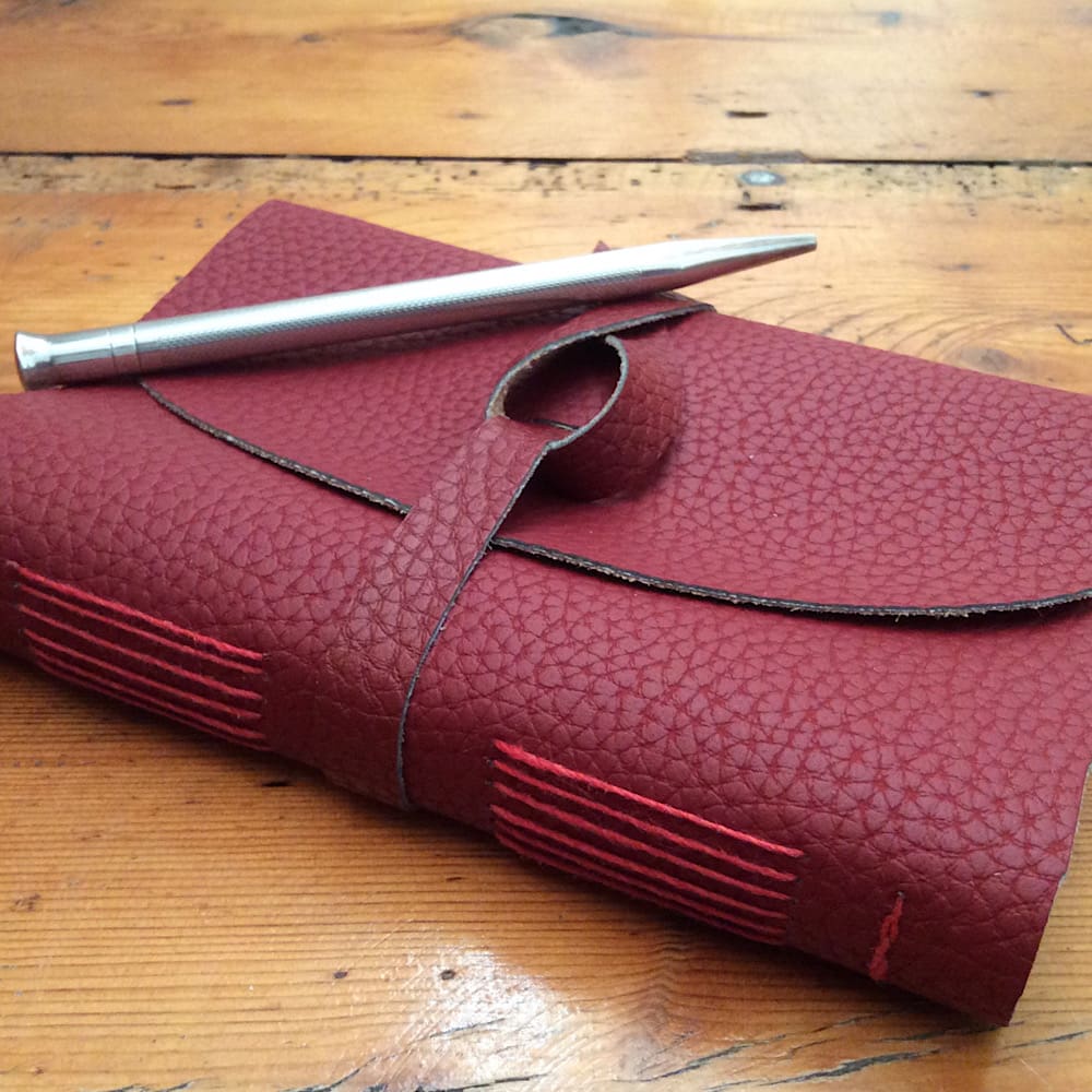 A7 handmade faux leather wrap journal filled with recycled paper