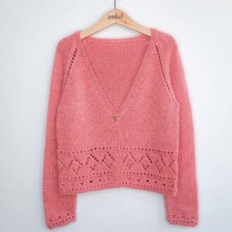 Girls cardigan in dusky pink, handknitted from a bamboo and merino blend wool by Debbie Bliss