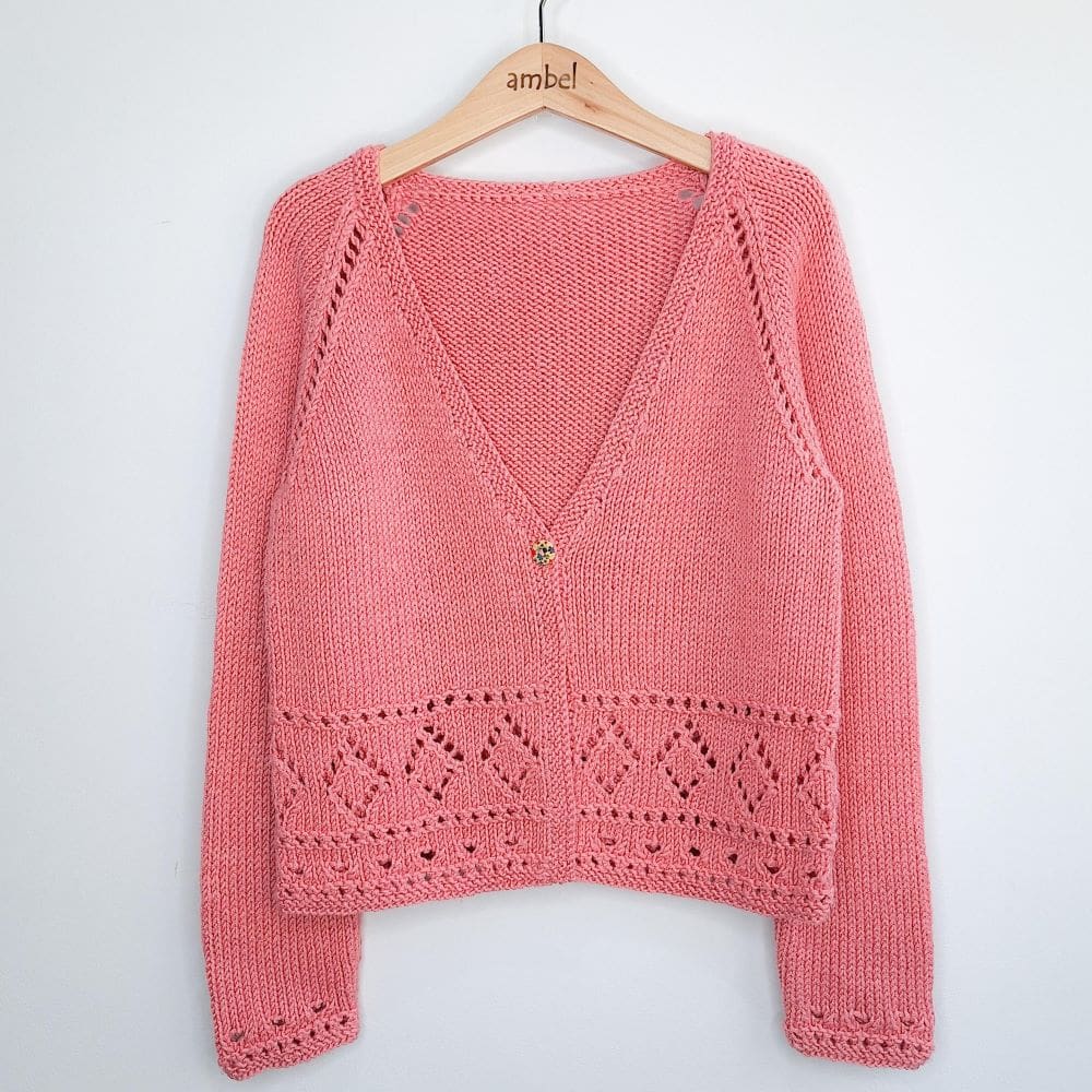 Girls cardigan in dusky pink, handknitted from a bamboo and merino blend wool by Debbie Bliss