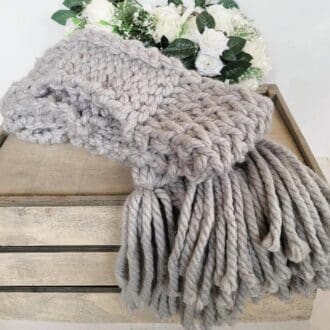 Grey chunky knit scarf with large grey tassels