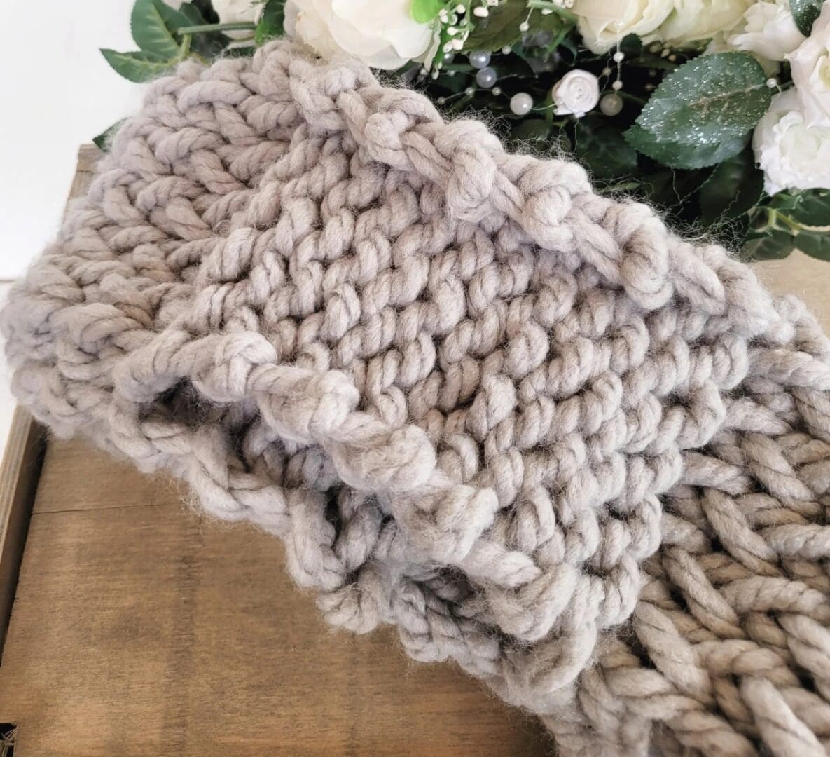 Grey chunky knit scarf folded up