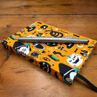 A6 handmade notebook covered in a Halloween themed fabric