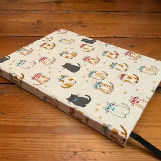 Fabric Covered hard cover A5 notebook filled with lined paper