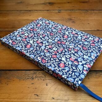 A5 handmade notebook covered in Primula Dawn Liberty Fabric with lined paper