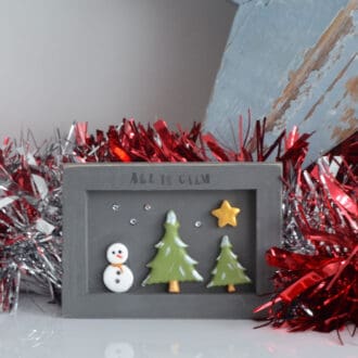 Handmade miniature wooden frame with a snowman festive scene, Christmas decoration