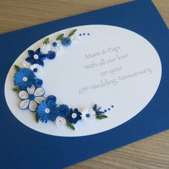 Handmade anniversary card for 65th wedding with blue and white quilled flowers