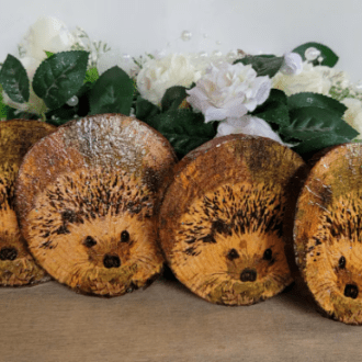 Four round wood slices with Hedgehog image on each one