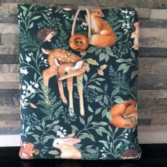 Kindle cover in green fabric with woodland animals