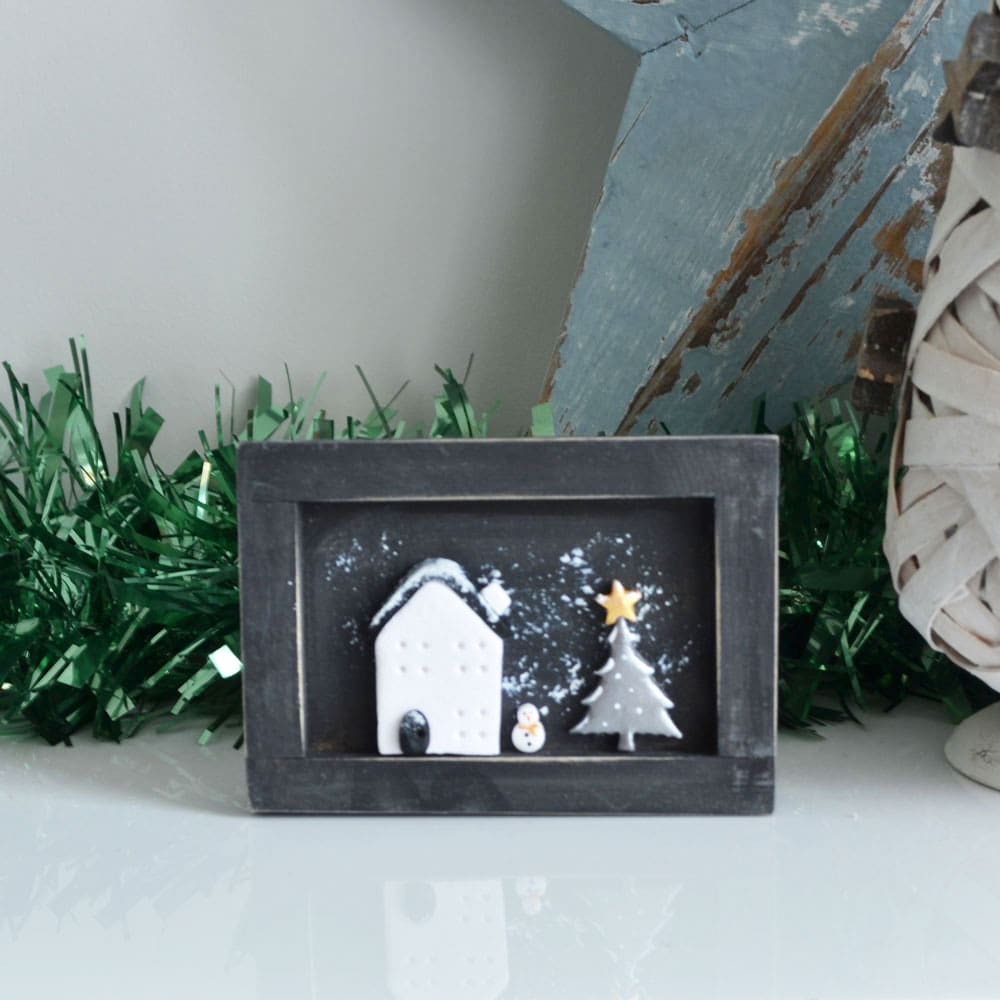 Handmade miniature wooden frame with clay Christmas scene