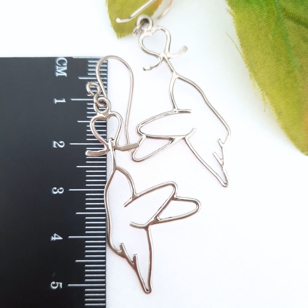 Sterling silver hummingbird and bleeding heart flower earrings.