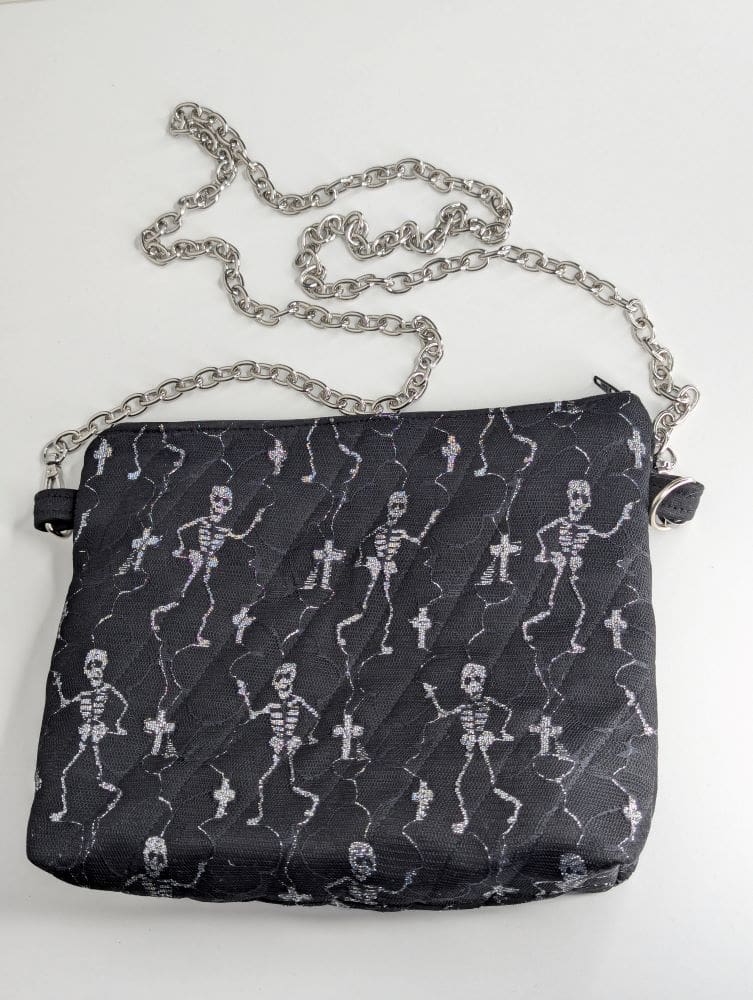 Small black halloween bag with dancing skeletons and chunky chain