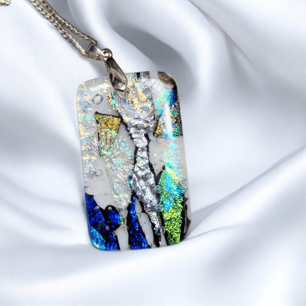 One-of-a-kind handmade blue dichroic glass pendant necklace with silver setting, featuring fused glass design, perfect as an anniversary or birthday gift for her.