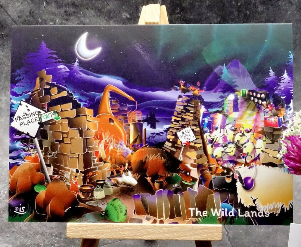 Larger image titled The Wild Lands showing an A6 size greetings card, blank inside, on a small easel. A gently humorous hard partying night-time scene set in our Highland wildlands.