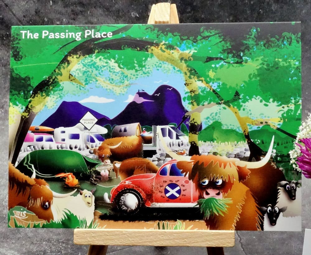 Larger image titled The Passing Place showing an A6 size greetings card, blank inside, on a small easel. A gently humorous lay-by scene of our busy tourist packed local roads.