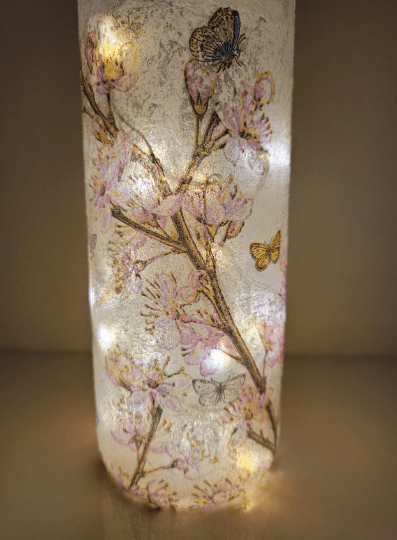 lit up standard wine bottle with flower butterfly design