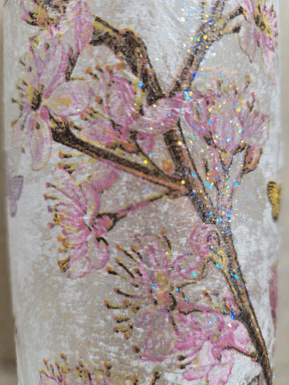 pink blossom design on a standard wine bottle