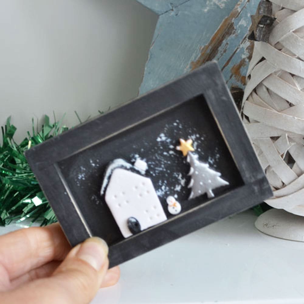 Handmade miniature wooden frame with clay Christmas scene