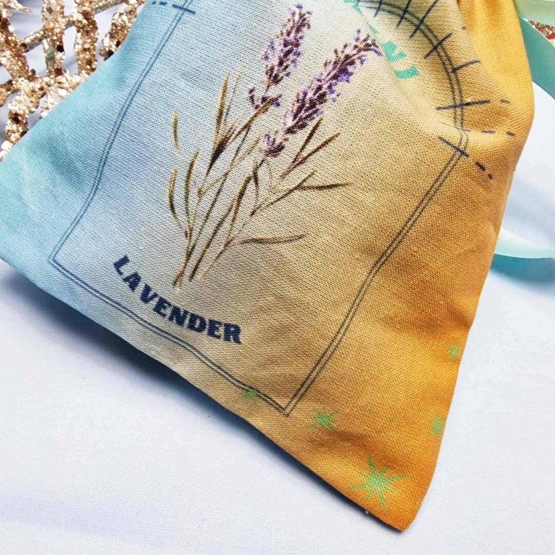 photo of a handmade cotton pouch with a digital print of gemini birth flower, lavender.