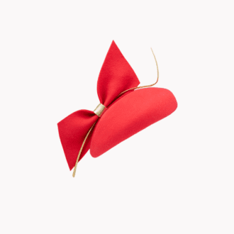 teardrop shape percher hat in poppy red felt with large bow and gold curled feather quill.